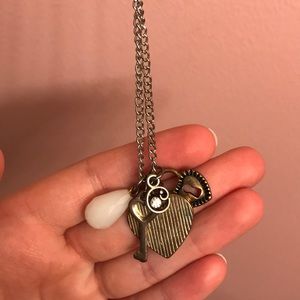 Gold necklace with adorable charms on it!